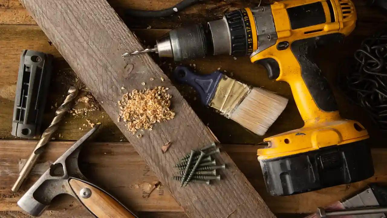 Water heater leak repair cost in La Mirada: plumbing and repair tools on a workbench