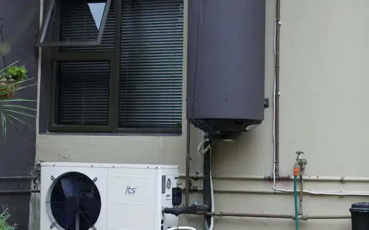 Water heater replacement in La Mirada: residential tank water heater mounted on an exterior wall